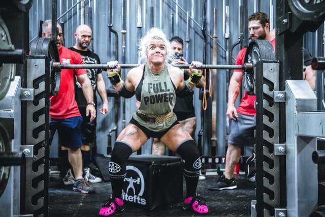 Female weightlifter performing squats