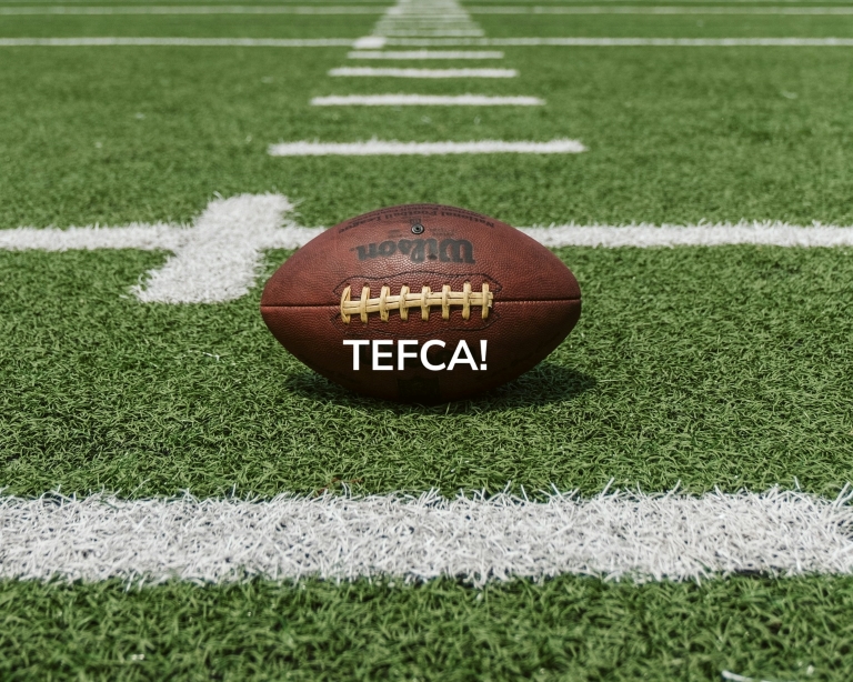 Football with the word TEFCA overlayed on a field along a hash mark