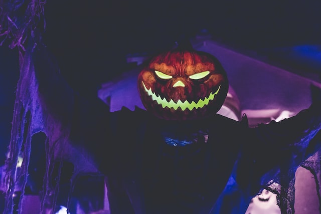 Jack-o'-lantern on the head of a shadowy figure